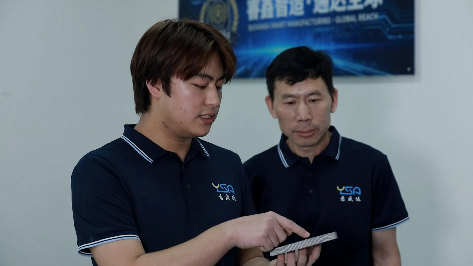 ROXARA team reviewing a manufactured part